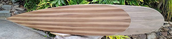 deck of tom blake inspired hollow wood paddle board by mike rumsey